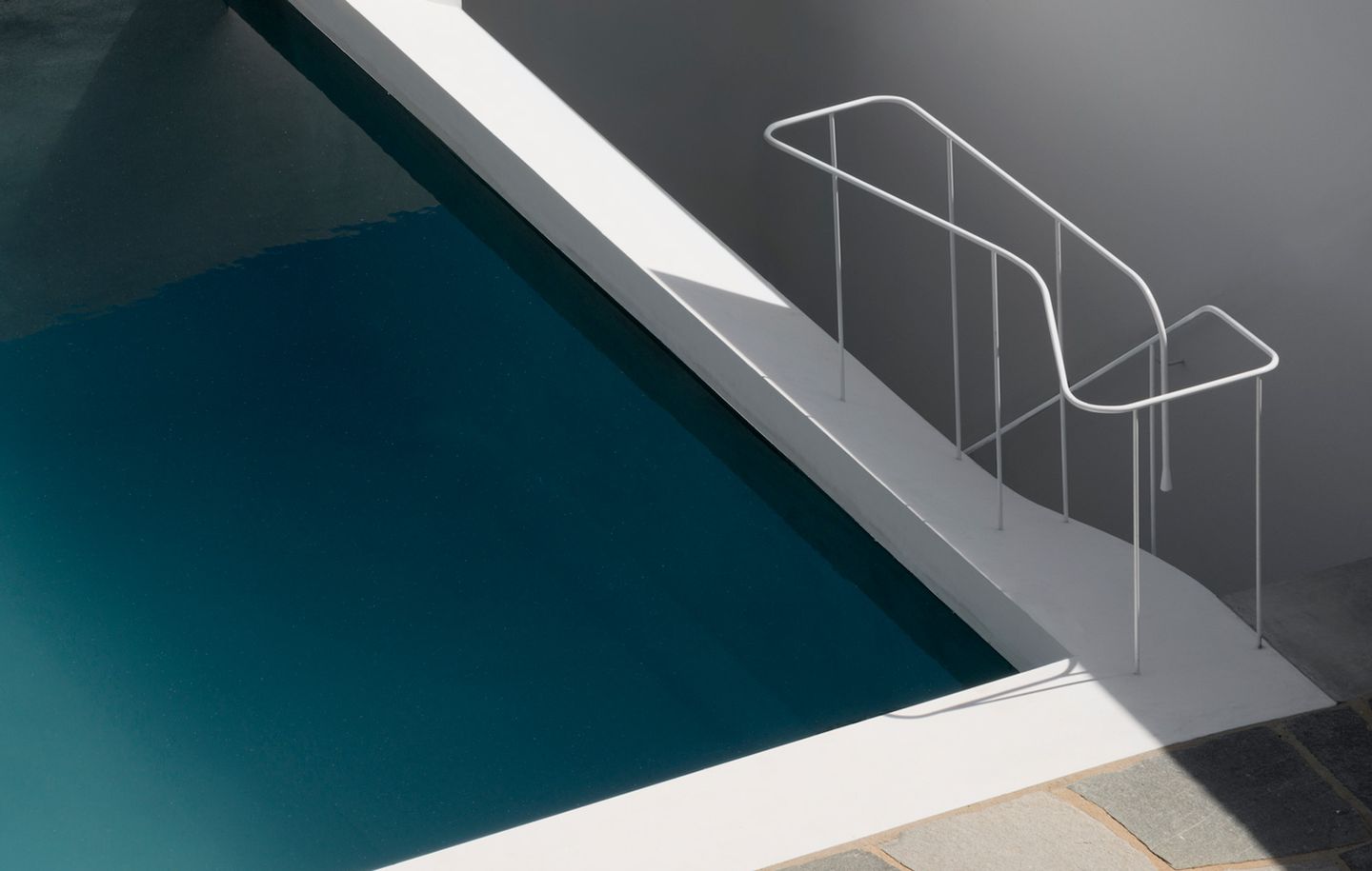  View of pool and handrail at beachfront house at Tamarama Sydney designed by Durbach Block Jaggers Architects