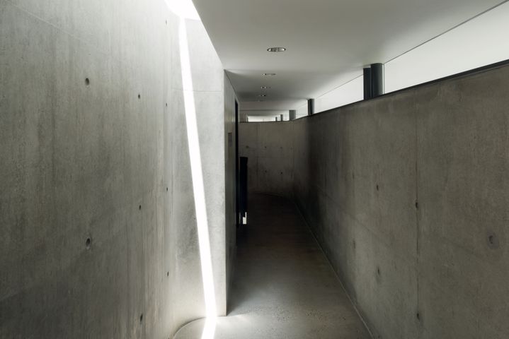  Sculptural concrete beachfront house located in Tamarama along the Bondi to Coogee walk designed by Durbach Block Jaggers Architects.