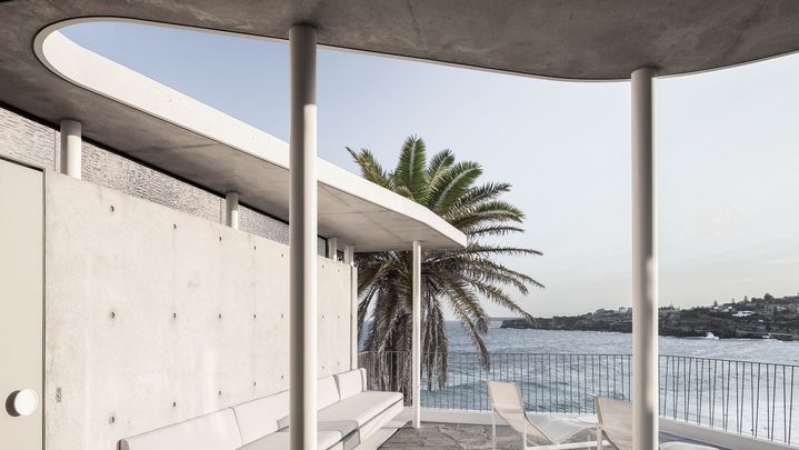  Sculptural concrete beachfront house located in Tamarama along the Bondi to Coogee walk designed by Durbach Block Jaggers Architects.