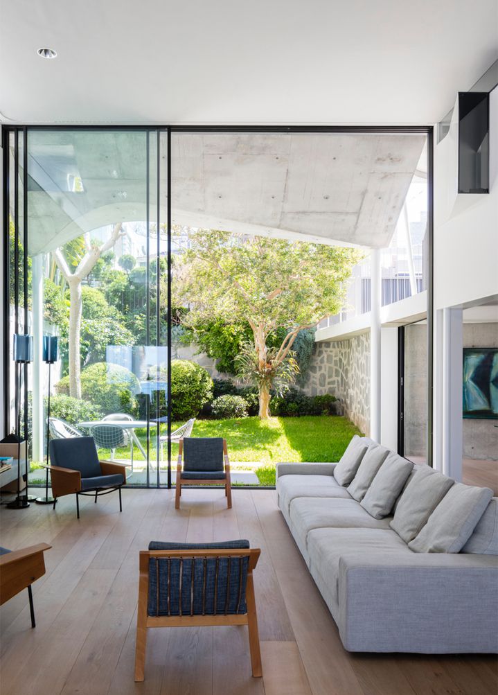  Sculptural concrete beachfront house located in Tamarama along the Bondi to Coogee walk designed by Durbach Block Jaggers Architects.