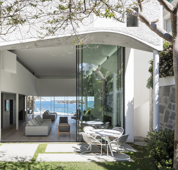  Sculptural concrete beachfront house located in Tamarama along the Bondi to Coogee walk designed by Durbach Block Jaggers Architects.