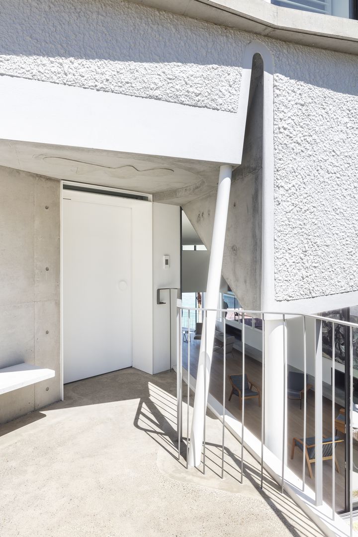  Sculptural concrete beachfront house located in Tamarama along the Bondi to Coogee walk designed by Durbach Block Jaggers Architects.