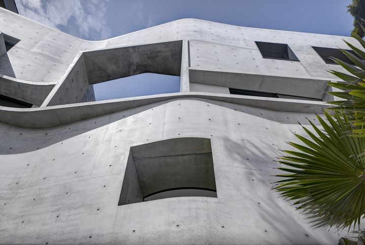  Raw sculptural concrete brutalist house on located on the Sydney harbour front in Point Piper designed by Durbach Block Jaggers Architects.