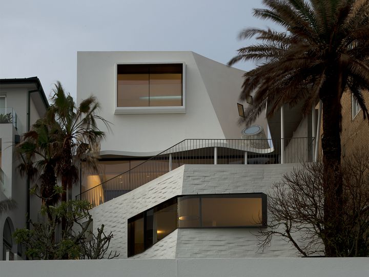  Sculptural concrete beachfront house located in Tamarama along the Bondi to Coogee walk designed by Durbach Block Jaggers Architects.