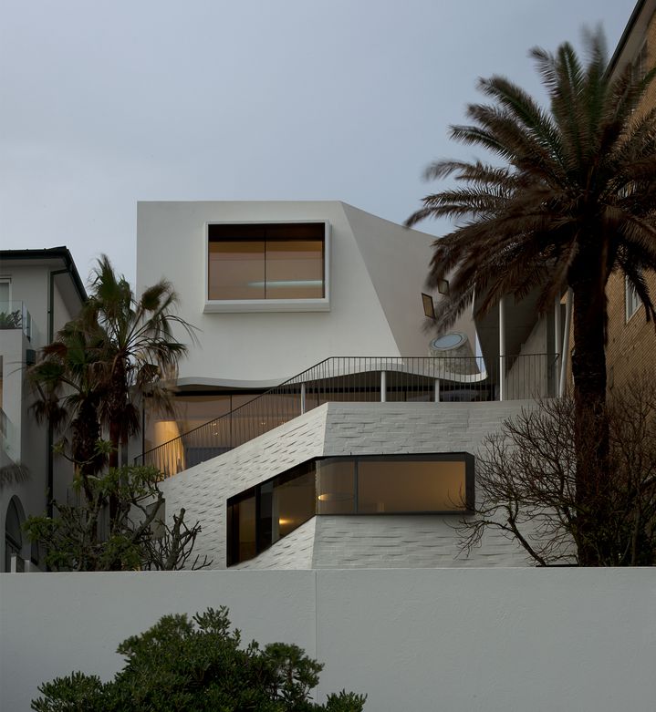  Sculptural concrete beachfront house located in Tamarama along the Bondi to Coogee walk designed by Durbach Block Jaggers Architects.